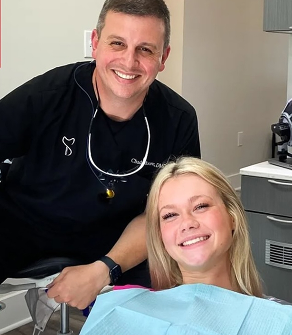 Dr. Moore and a patient smiling