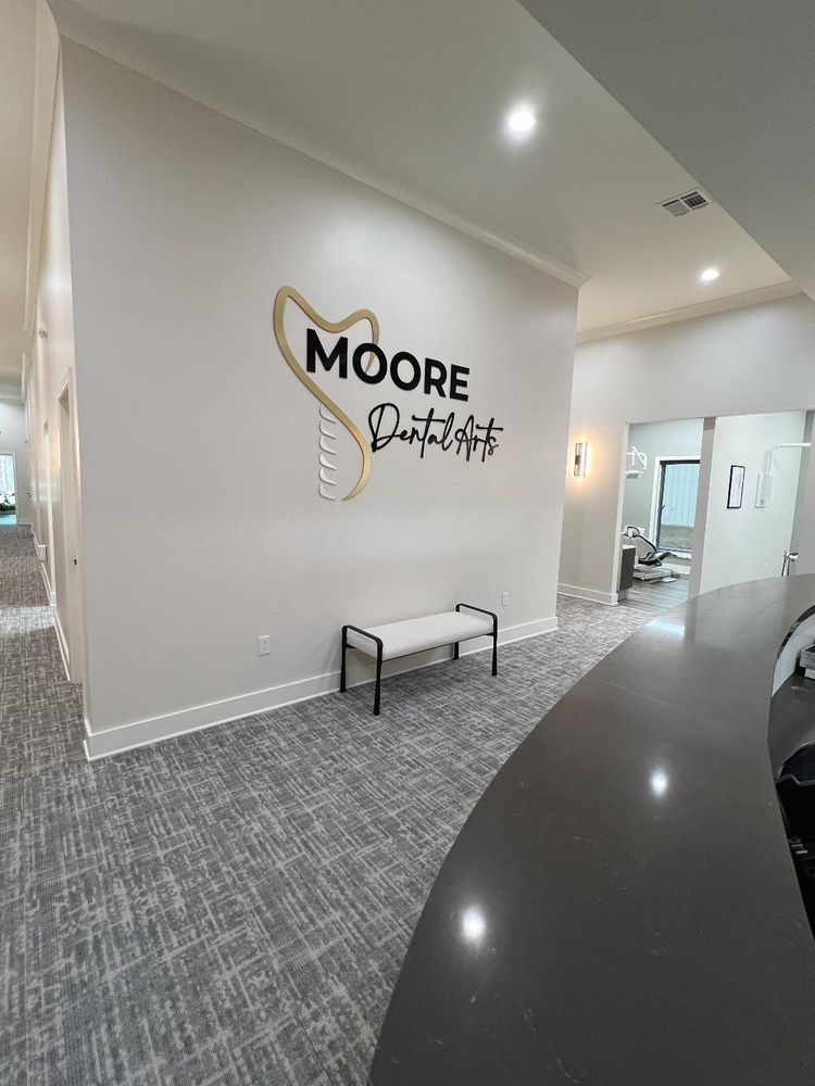 Moore Dental Arts front desk welcoming patients seeking dental insurance support and dentistry care.