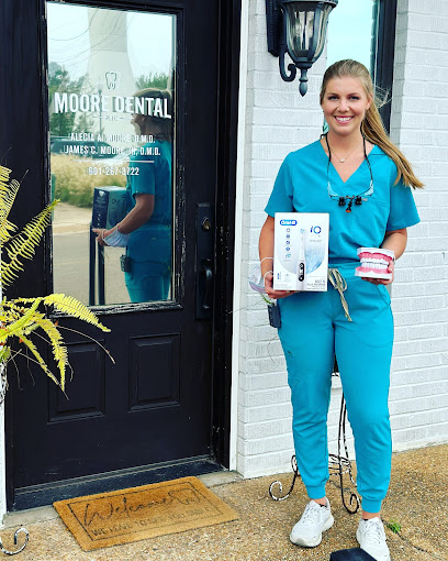 A dental hygienist carrying dental materials